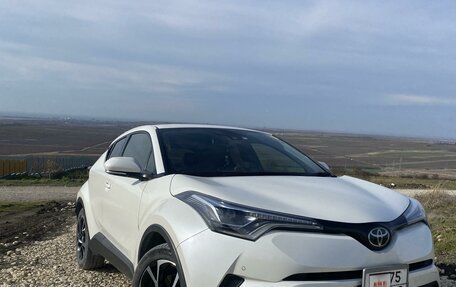 Toyota C-HR I рестайлинг, 2018 год, 2 740 000 рублей, 19 фотография