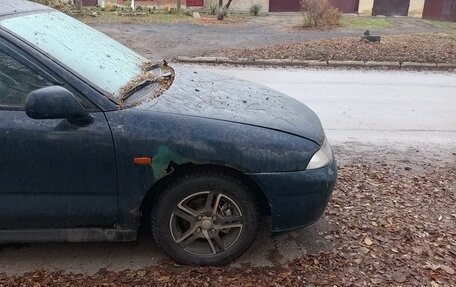 Mitsubishi Carisma I, 1996 год, 100 000 рублей, 4 фотография