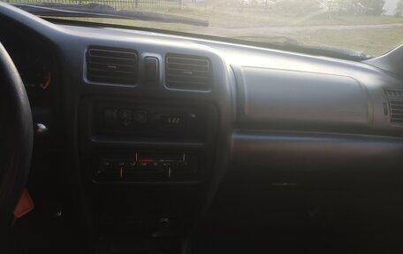 Mazda 323, 1998 год, 163 000 рублей, 11 фотография
