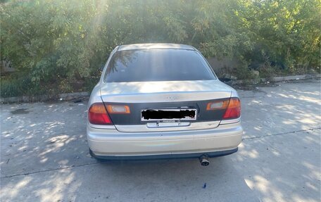 Mazda Familia, 1996 год, 128 000 рублей, 2 фотография