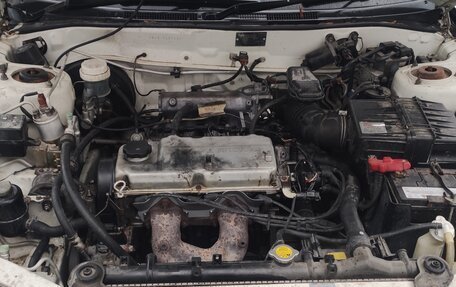 Mitsubishi Mirage VI рестайлинг, 1999 год, 135 000 рублей, 11 фотография