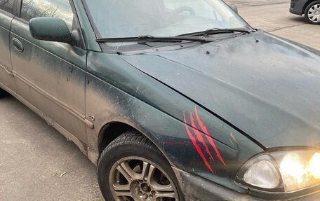 Toyota Avensis III рестайлинг, 1998 год, 110 000 рублей, 3 фотография