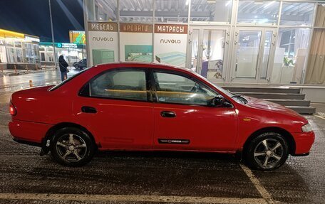 Mazda 323, 1997 год, 185 000 рублей, 23 фотография