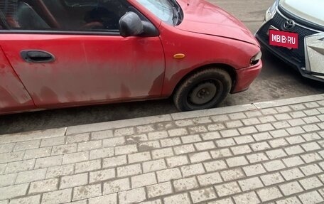 Mazda 323, 1998 год, 150 000 рублей, 6 фотография