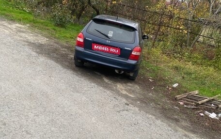 Mazda 323, 1999 год, 155 000 рублей, 17 фотография