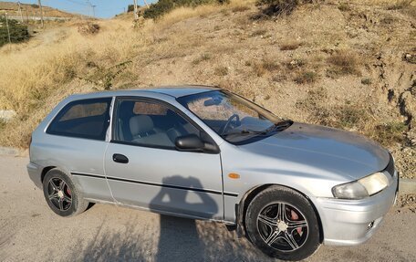 Mazda 323, 1998 год, 190 000 рублей, 8 фотография