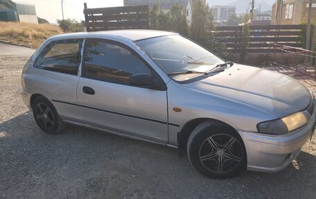 Mazda 323, 1998 год, 190 000 рублей, 10 фотография