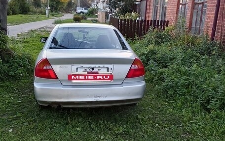 Mitsubishi Mirage VI рестайлинг, 2001 год, 120 000 рублей, 4 фотография