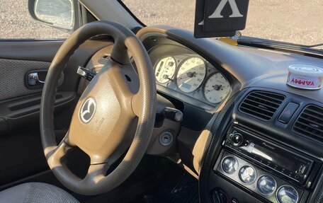 Mazda Protege, 1999 год, 188 000 рублей, 5 фотография