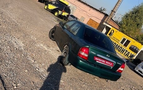 Mazda Protege, 1999 год, 188 000 рублей, 10 фотография