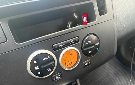 Nissan Tiida, 2010 год, 645 000 рублей, 10 фотография