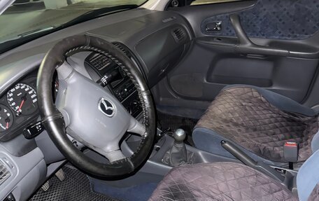 Mazda 323, 2000 год, 310 000 рублей, 13 фотография
