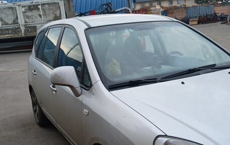 KIA Carens III (RP), 2009 год, 590 000 рублей, 2 фотография